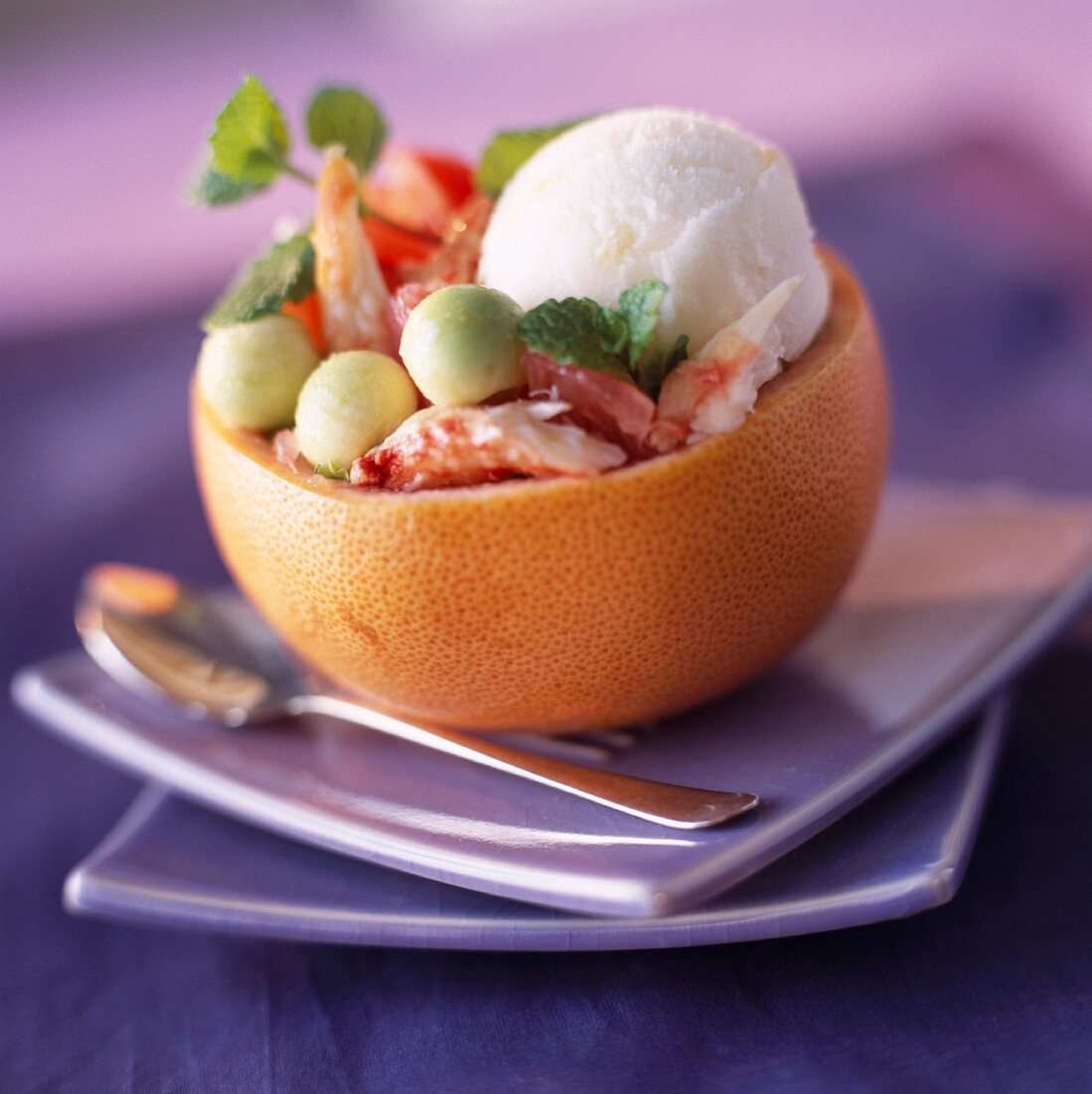 Grapefruit filled with lemon sorbet, crab and avocado