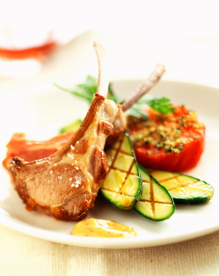 Lamb chops with grilled tomato and courgettes