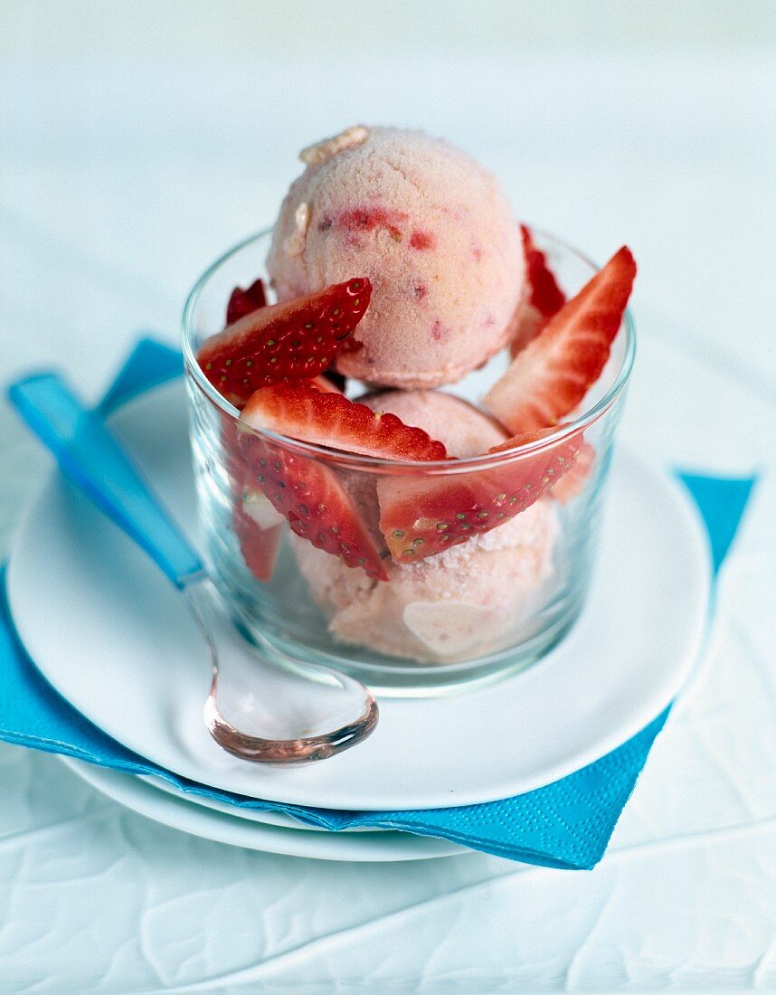 Scoops of strawberry ice cream with strawberry pieces