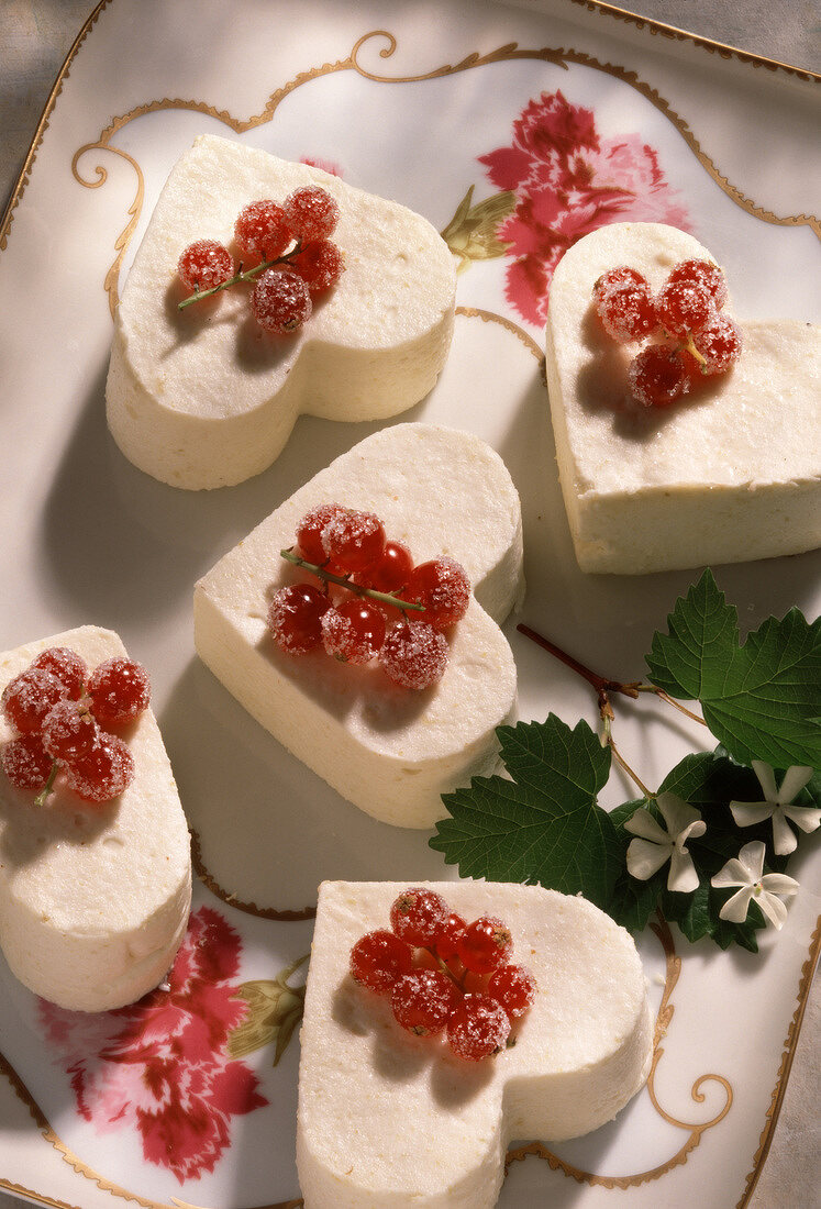 Heart-shaped blancmange with redcurrants