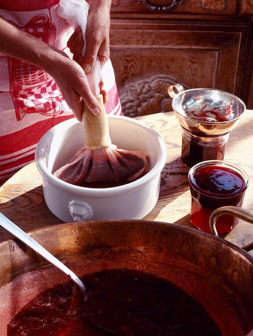 Preparing raspberry wine and wild strawberry jelly