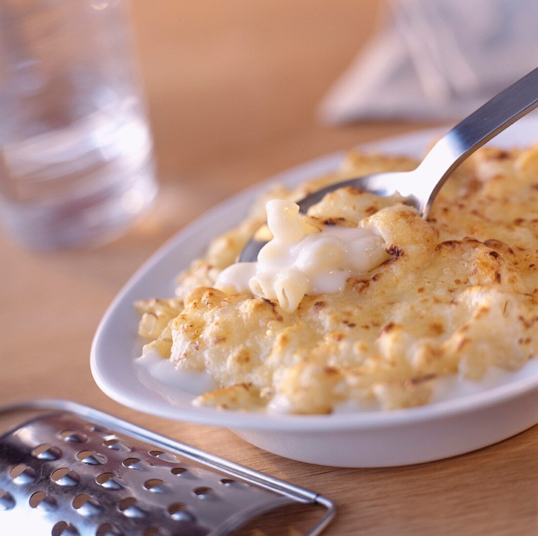 Pasta and bechamel cheese-topped dish