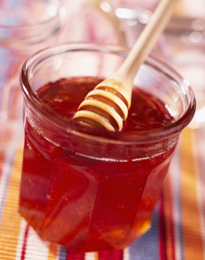 Pot of honey with honey spoon