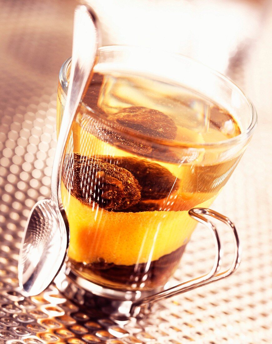 Prunes in tea with orange zest (topic : drinking fruits)