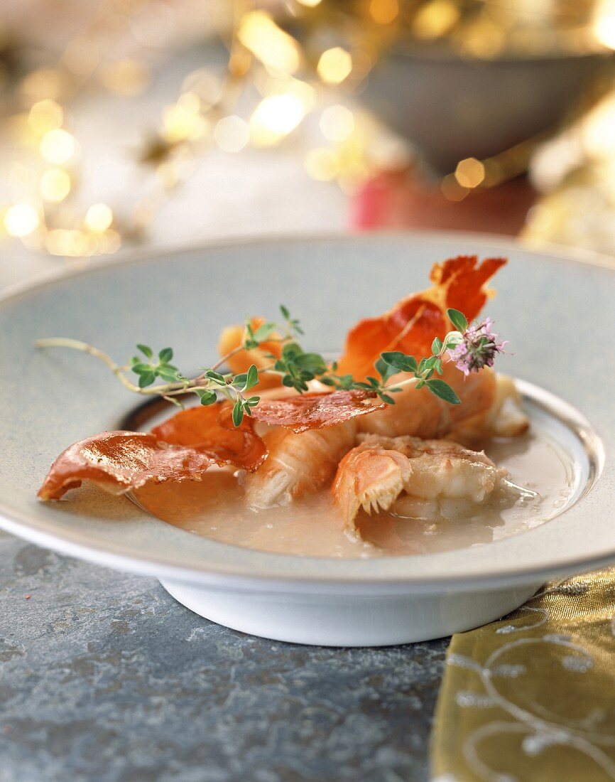 Creamed coconut soup with roast langoustines and serrano ham