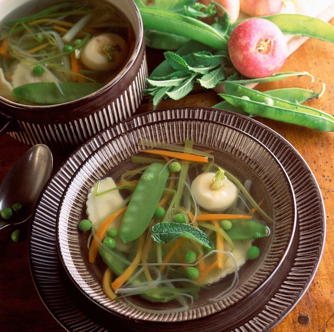 Spring soup with peas, sugar peas and leeks