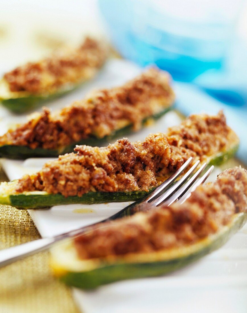 Courgette stuffed with raw ham and mushrooms