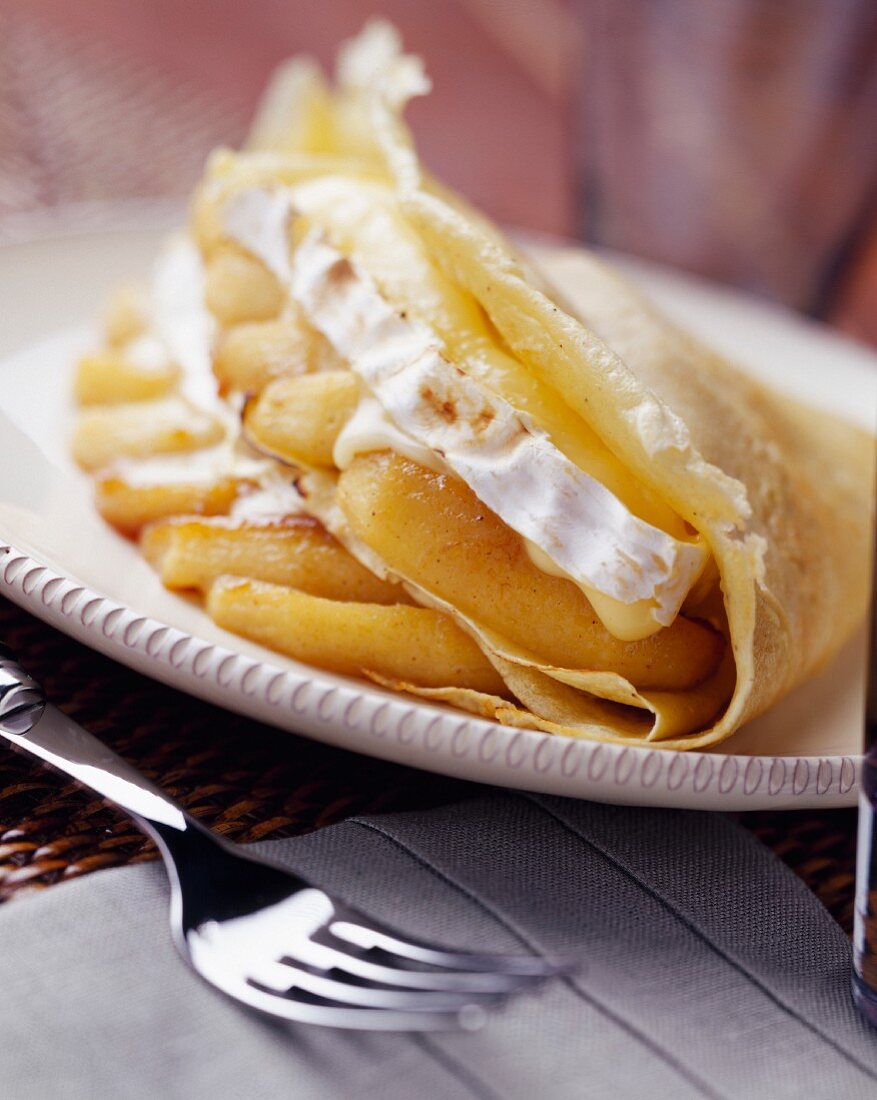 Pancake filled with camembert and baked apples