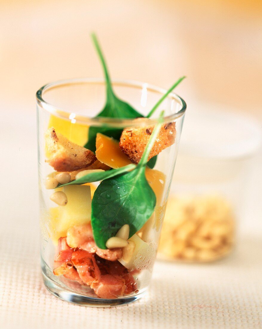Bacon, potato and cheese salad in glass