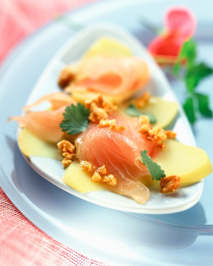 Sea bream carpaccio with peanut and coriander sauce