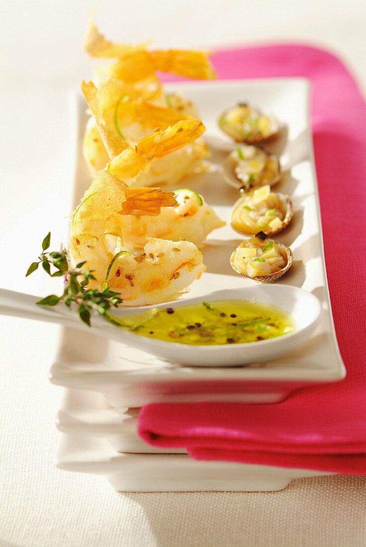 Fried prawns and clams in olive oil