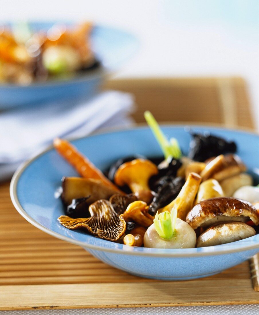 Fried vegetables and mushrooms in bowl