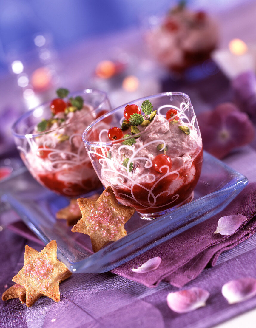 Fromage frais with summer fruit, redcurrant puree and star-shaped biscuits