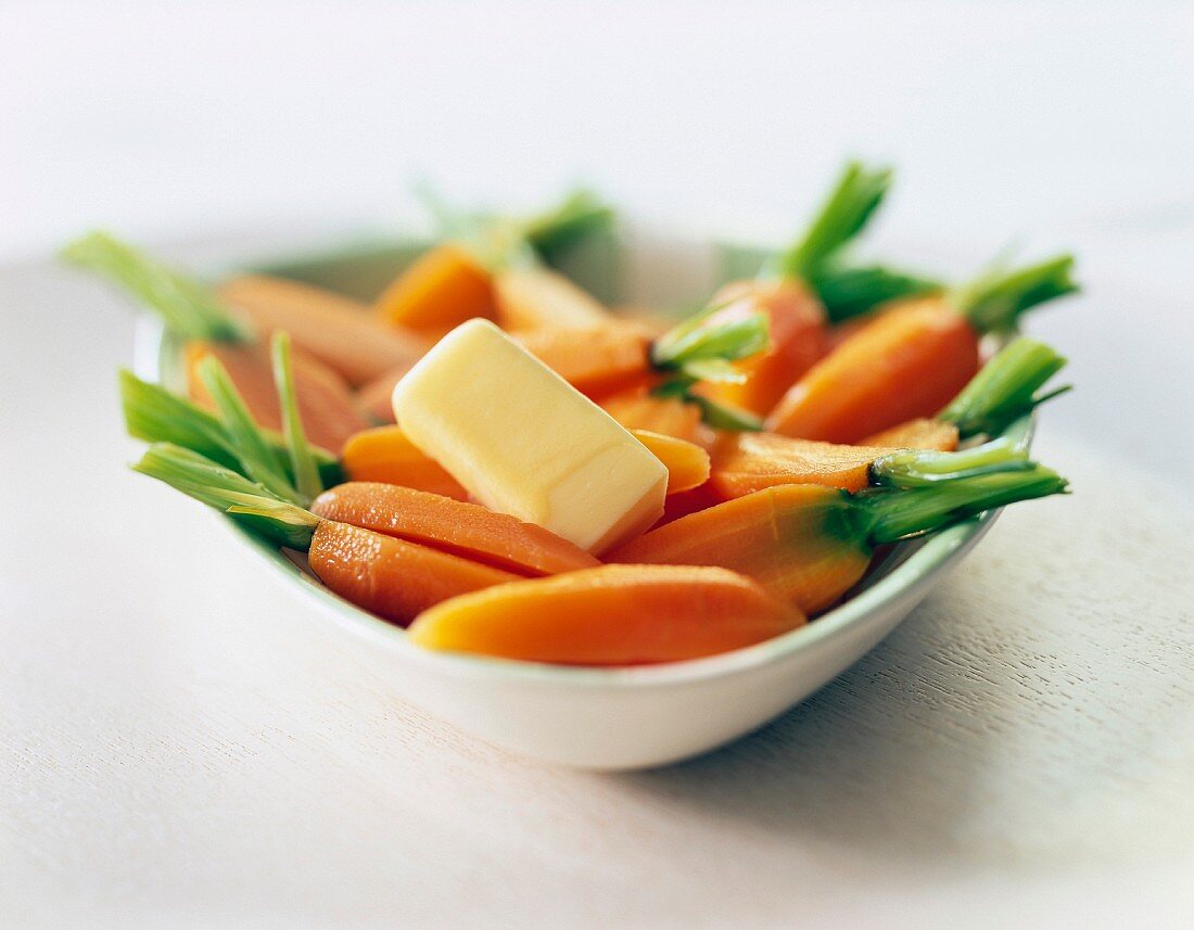 Steam-cooked carrots with a nut of butter