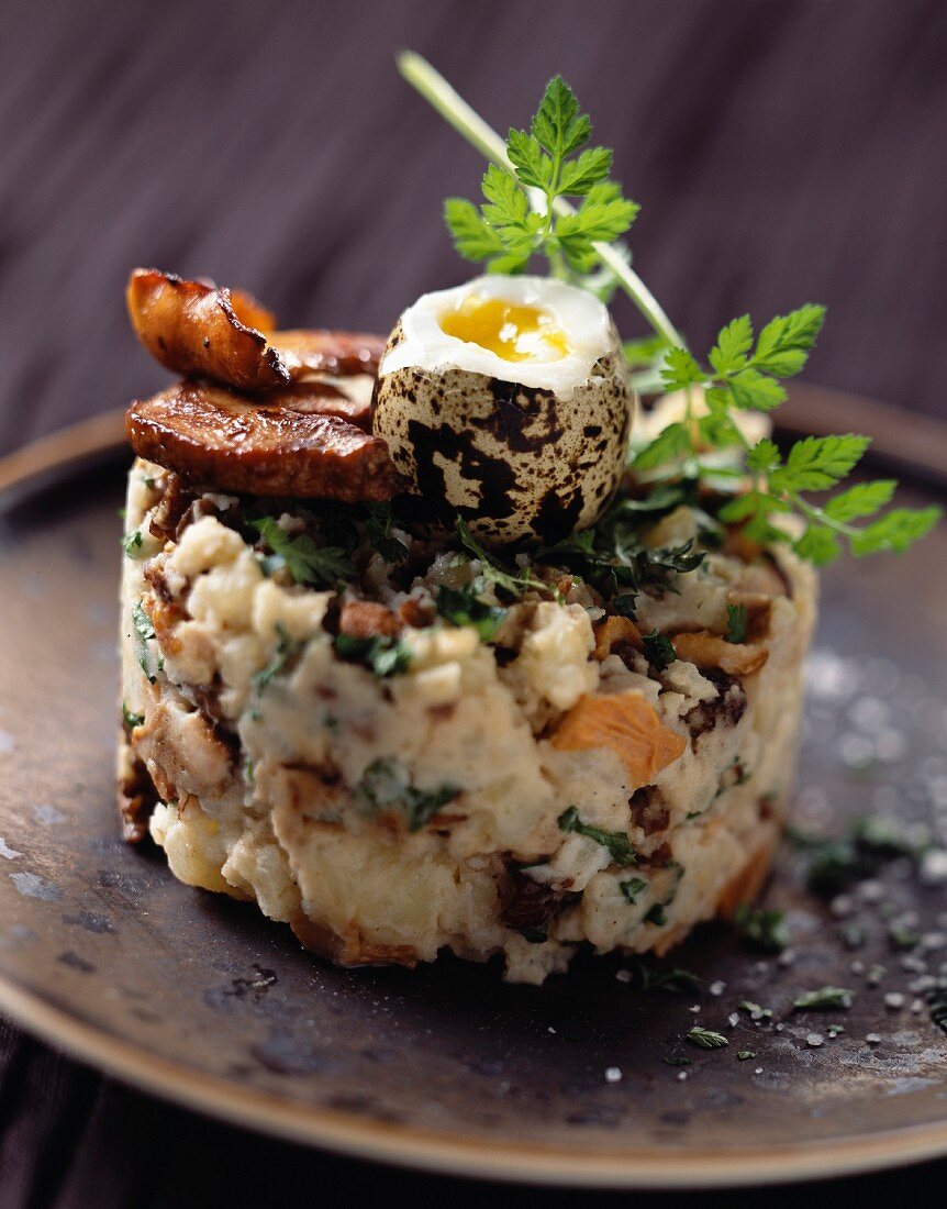 Fish and potato tartare with ceps and quail eggs