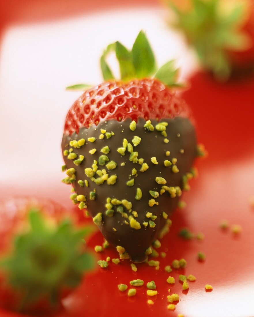 Strawberry dipped in chocolate with pistachio