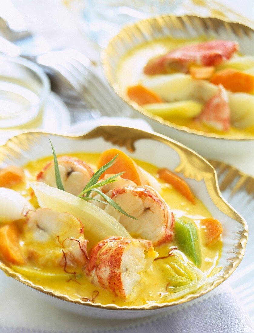 Lobster and vegetables in saffron-flavored stock