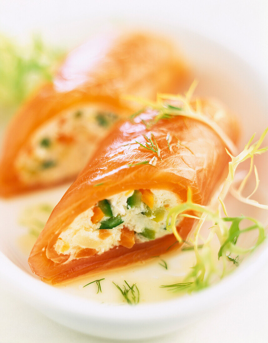 Smoked salmon rolls filled with Fromage frais and young vegetables