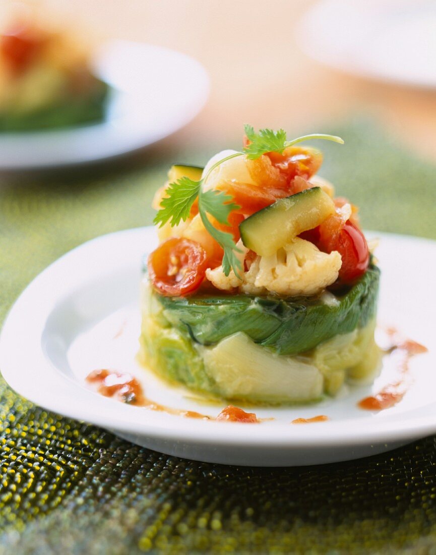 Leek timbale with crunchy vegetables