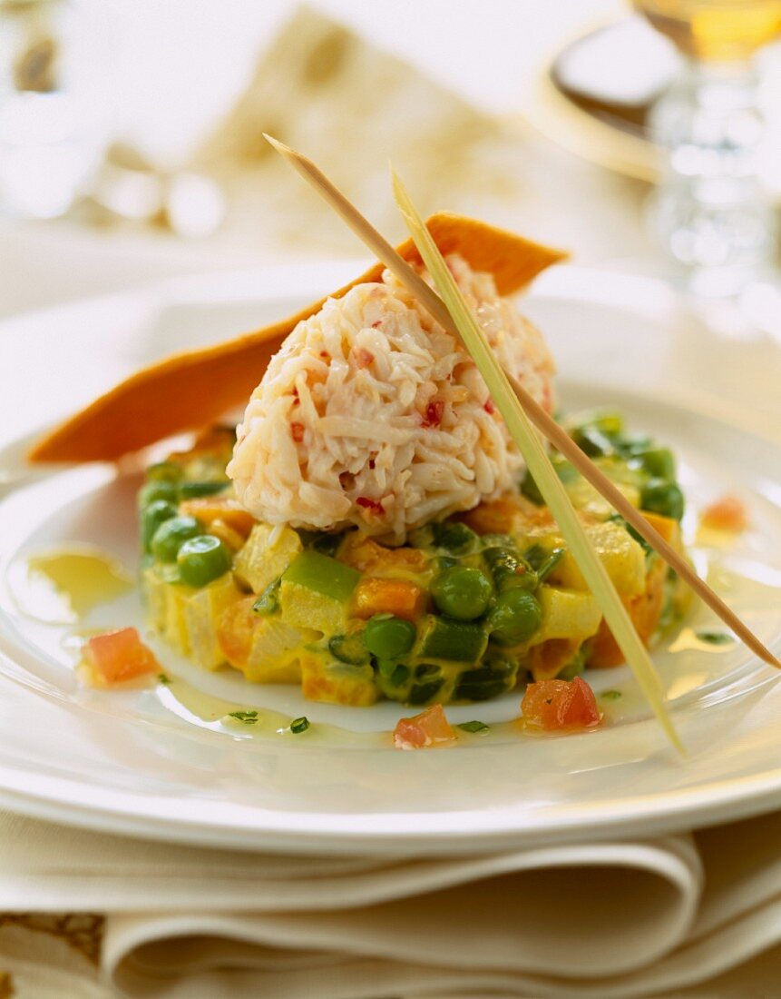 Crab meat Quenelle on mixed vegetable timbale