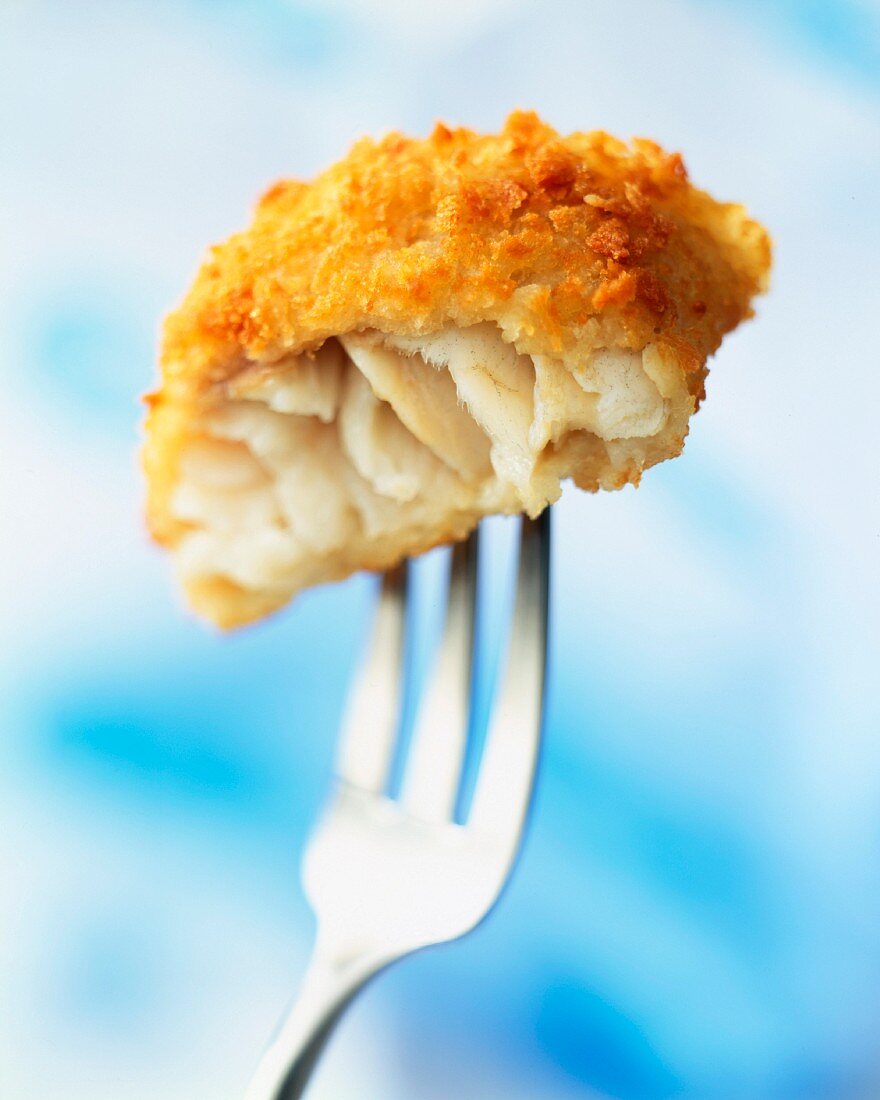 Crunchy breaded cod on fork