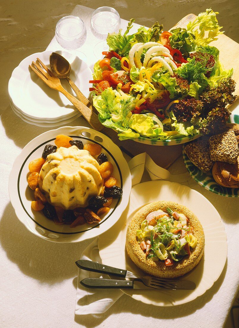 Wholefood meal: semolina, vegetables in sesame ring, salad