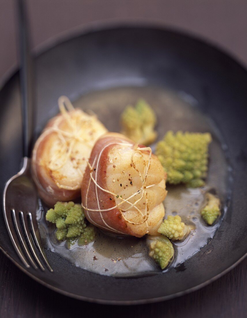 Monkfish wrapped in bacon with romanesco broccoli