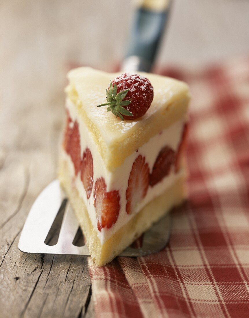 Slice of strawberry cream cake