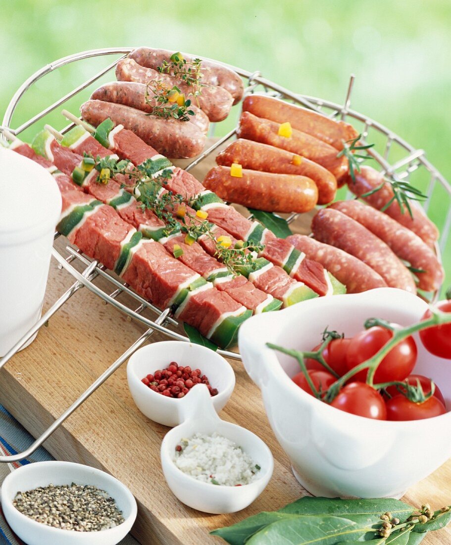 Selection of raw brochettes and mini sausages