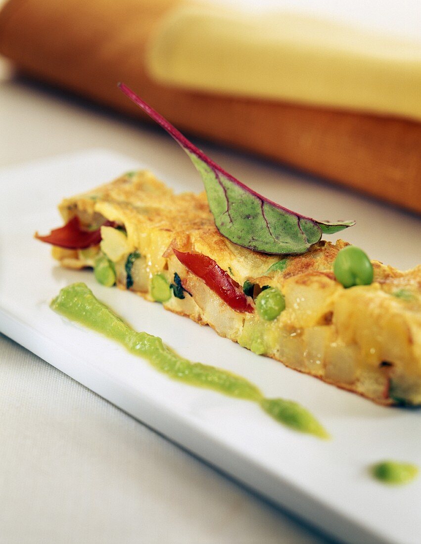 Vegetable omelet with peas and tomatoes
