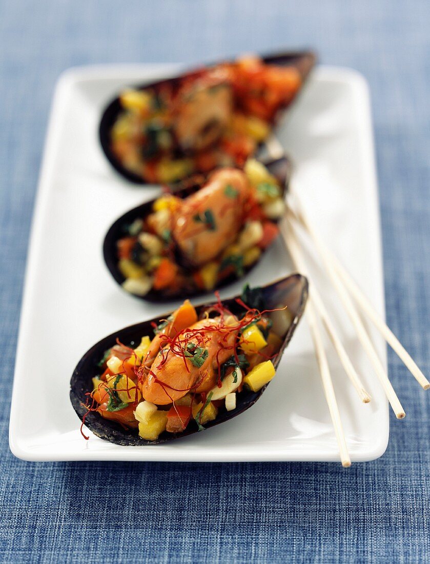 Mussels stuffed with yellow and red peppers and saffron