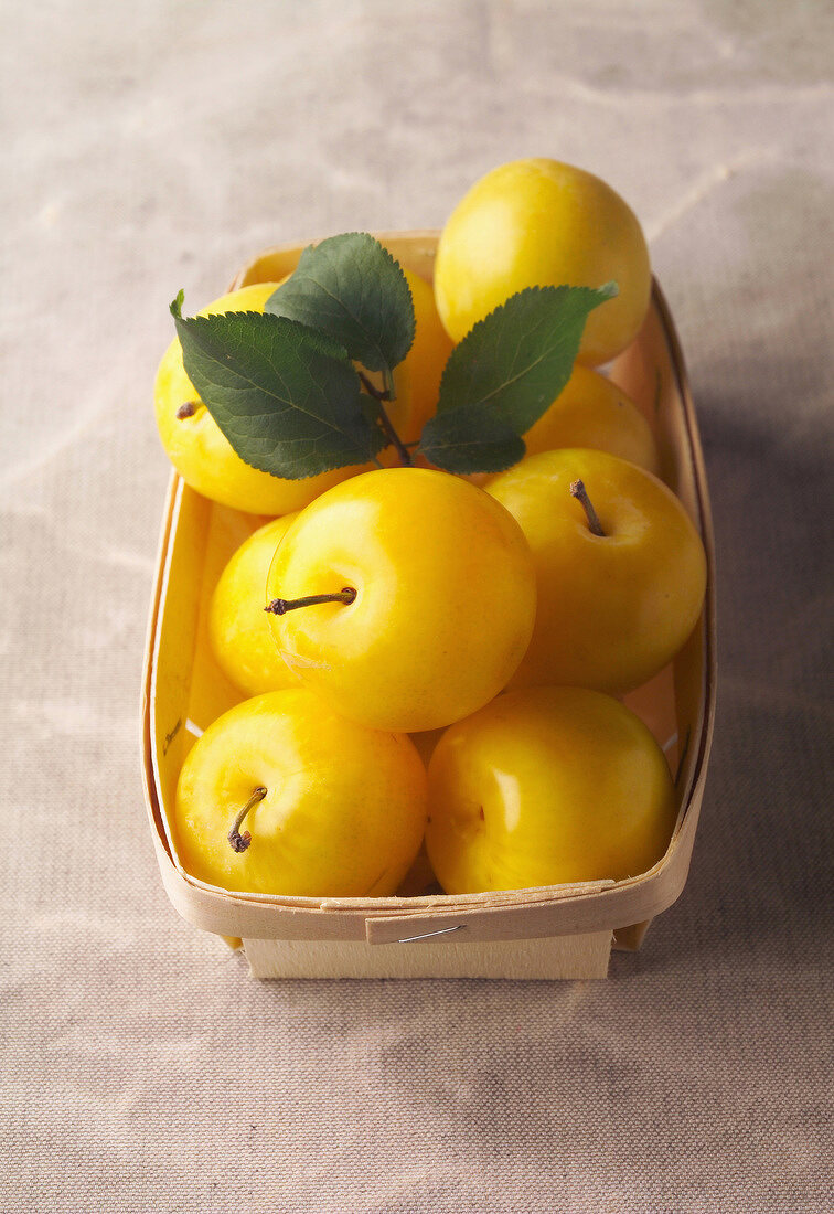 punnet of yellow plums