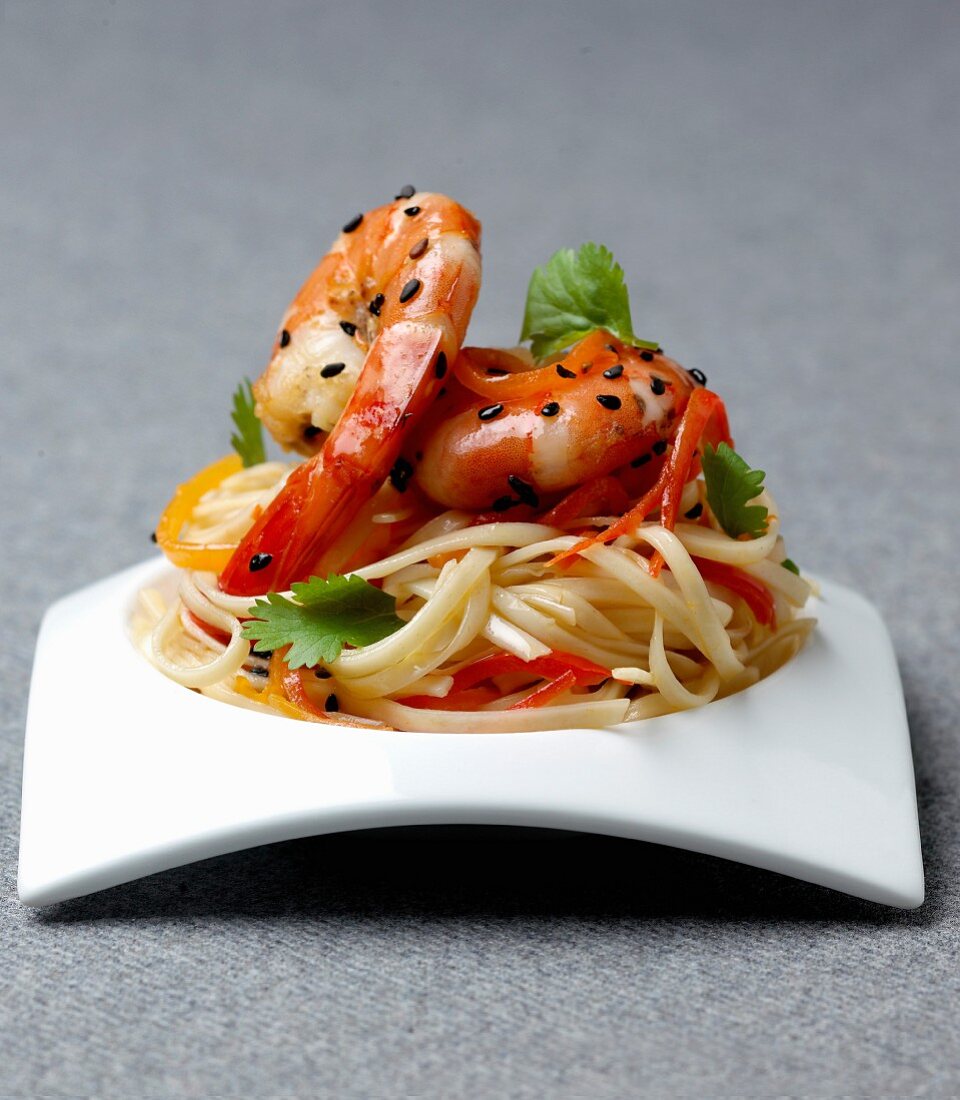 Linguine pasta with prawns and black sesame seeds