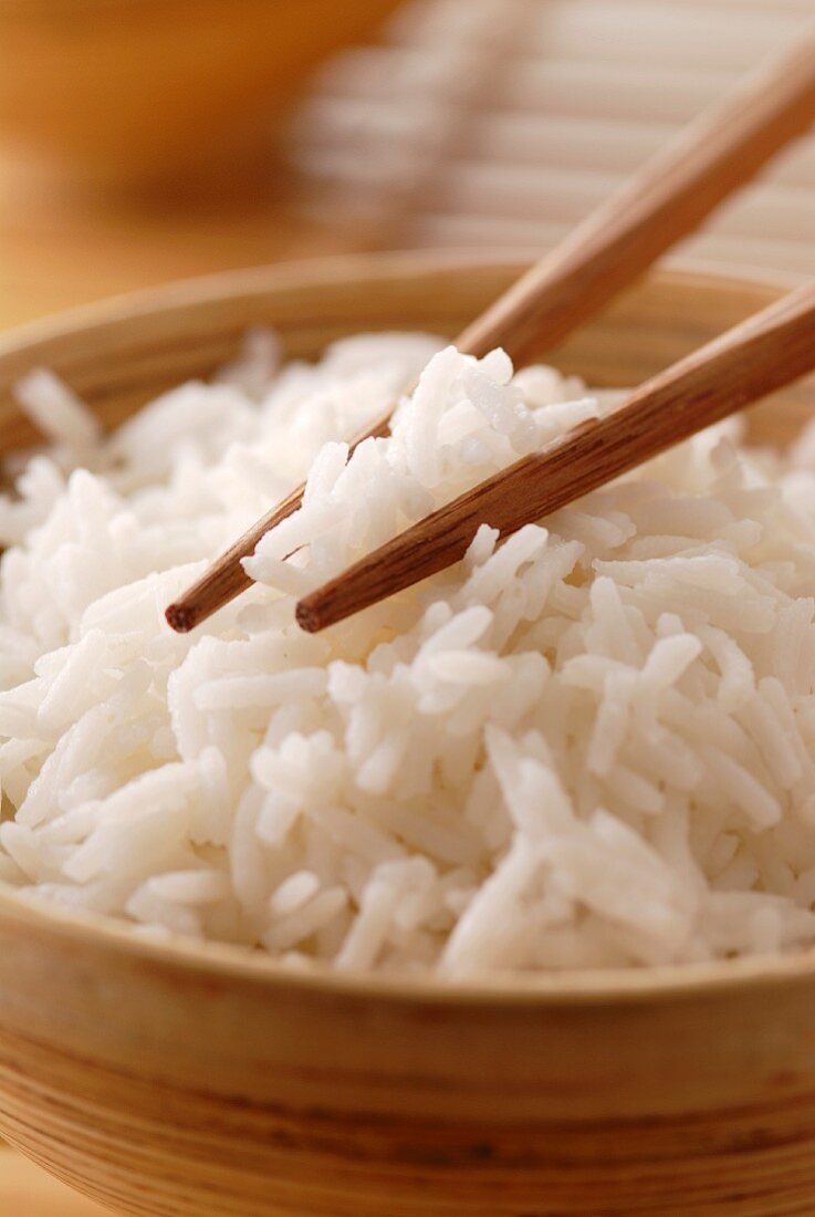 Eating rice with chopsticks