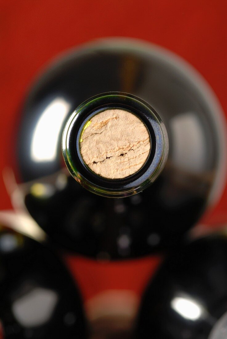 The neck and the cork of a bottle of wine