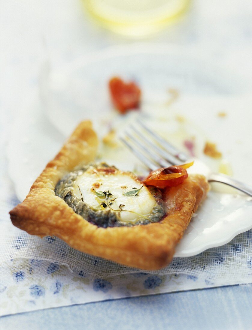 Goat cheese and tomato puff-pastry tartlet