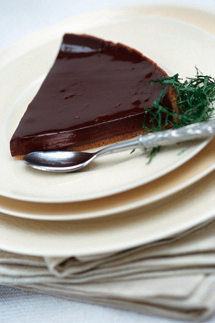 A slice of cream chocolate tart