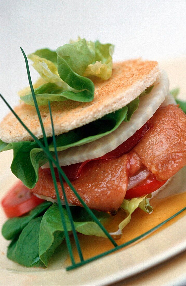 An appetiser with salmon, kohlrabi and bacon