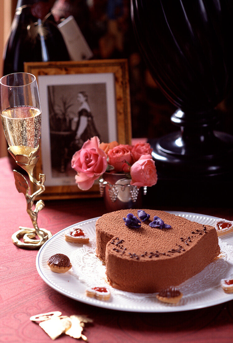 Heart-shaped chocolate cake and champagne for St Valentine's Day