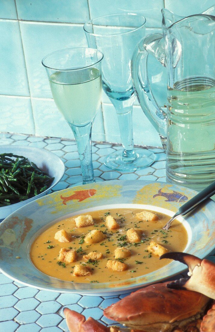 Cream of fish soup with croutons