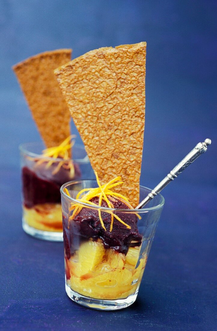 Verrine of citrus fruit with blackberry sorbet and crunchy biscuit