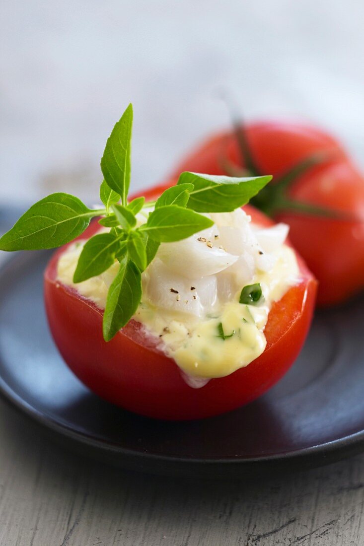 Tomatoes stuffed with cod and mayonnaise