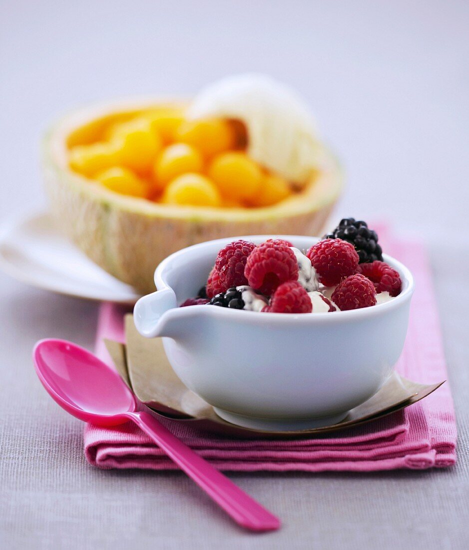 Raspberries and blackberries with whipped cream,melon with muscat de baumes de venise