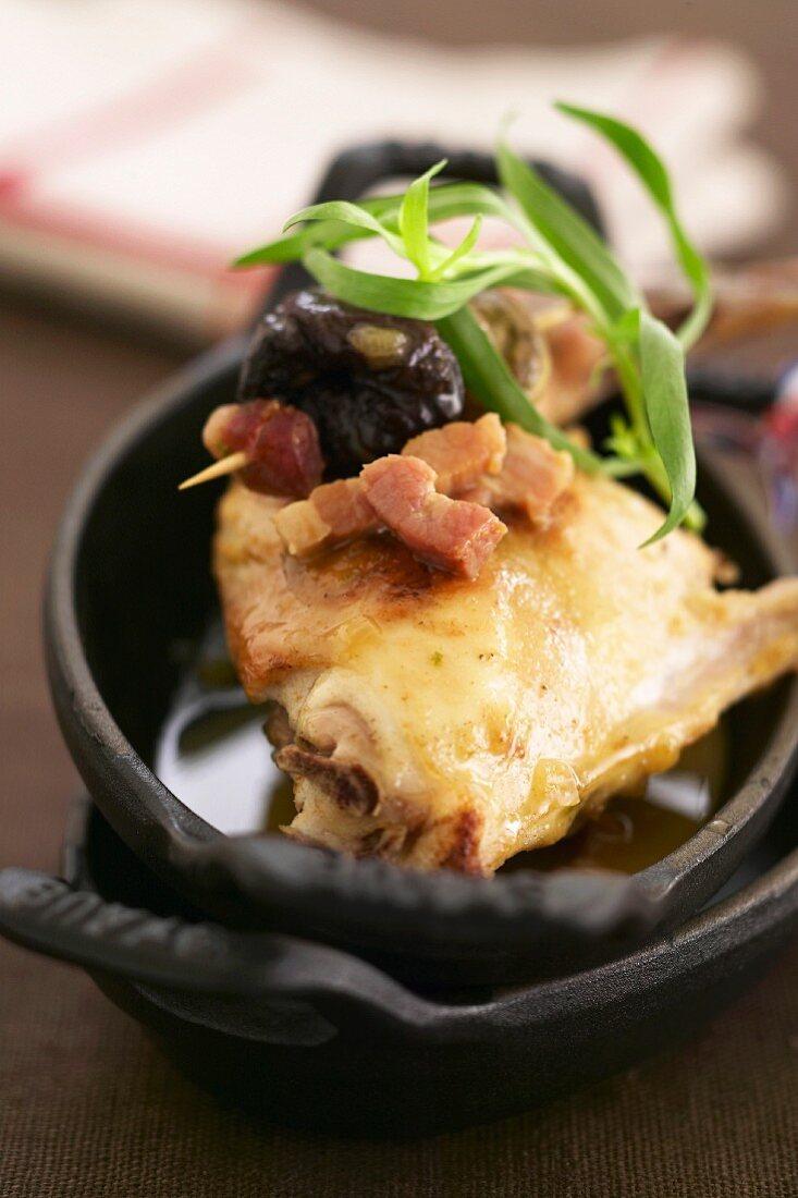 Sauteed rabbit with prunes and diced bacon