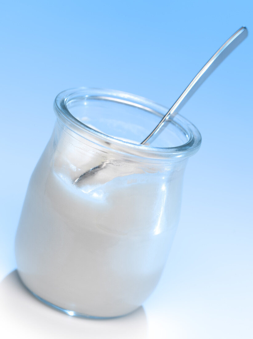 Glass pot of plain yoghurt