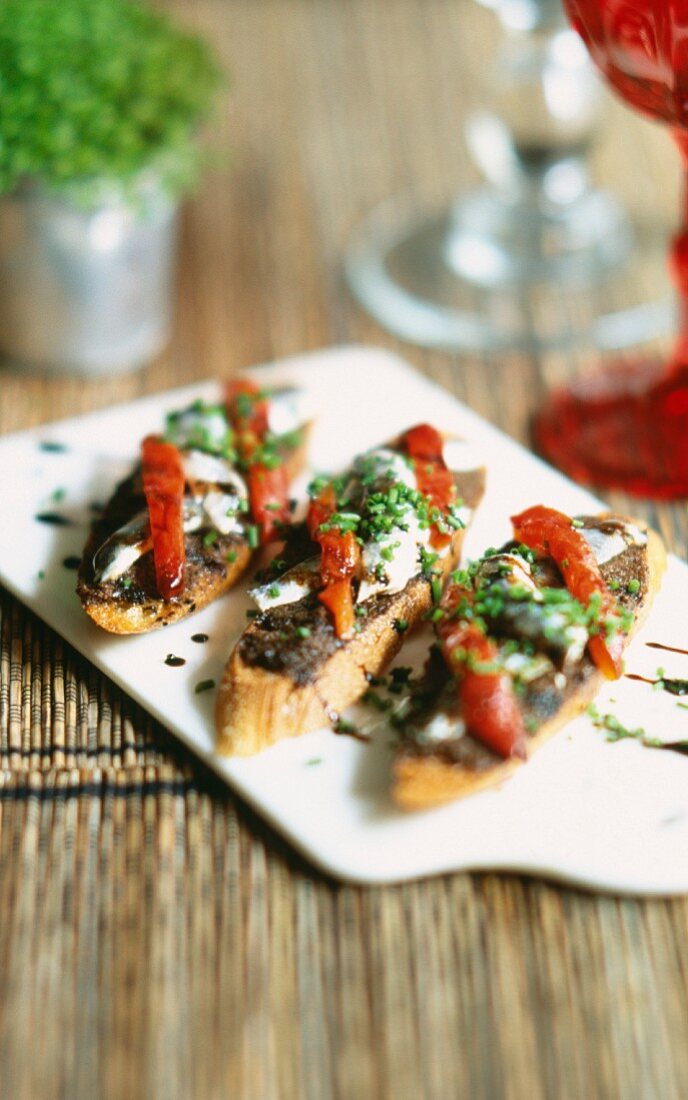 tapenade and anchovies on toast