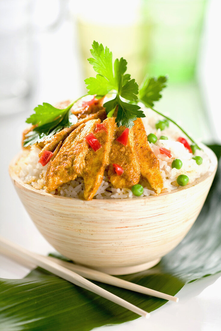 Bowl of rice with spicy chicken slivers