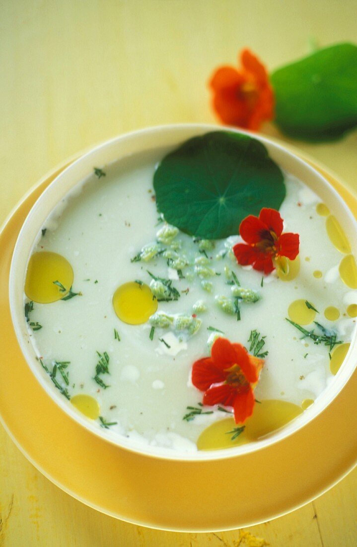 Coconut milk soup with wild asparagus and water cress