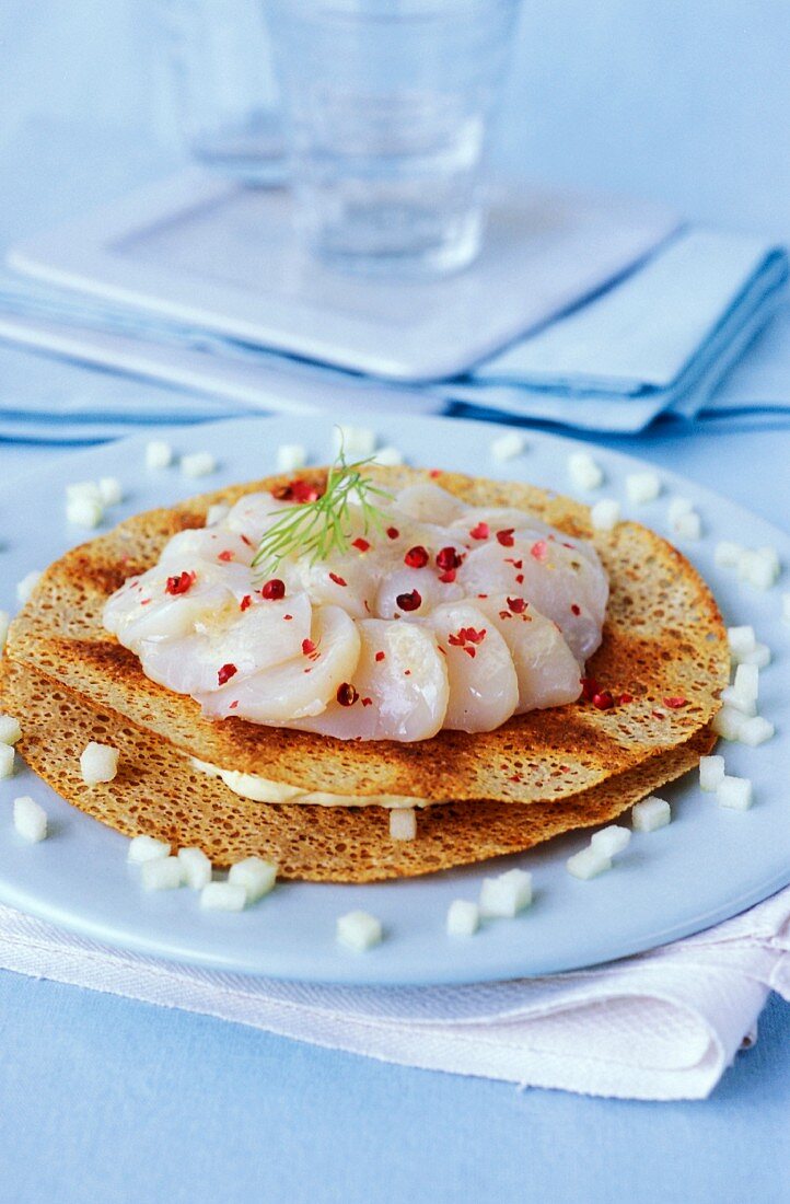 Buckwheat crepes with raw scallops