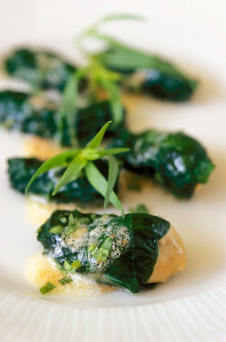 Oysters wrapped in spinach with tarragon butter